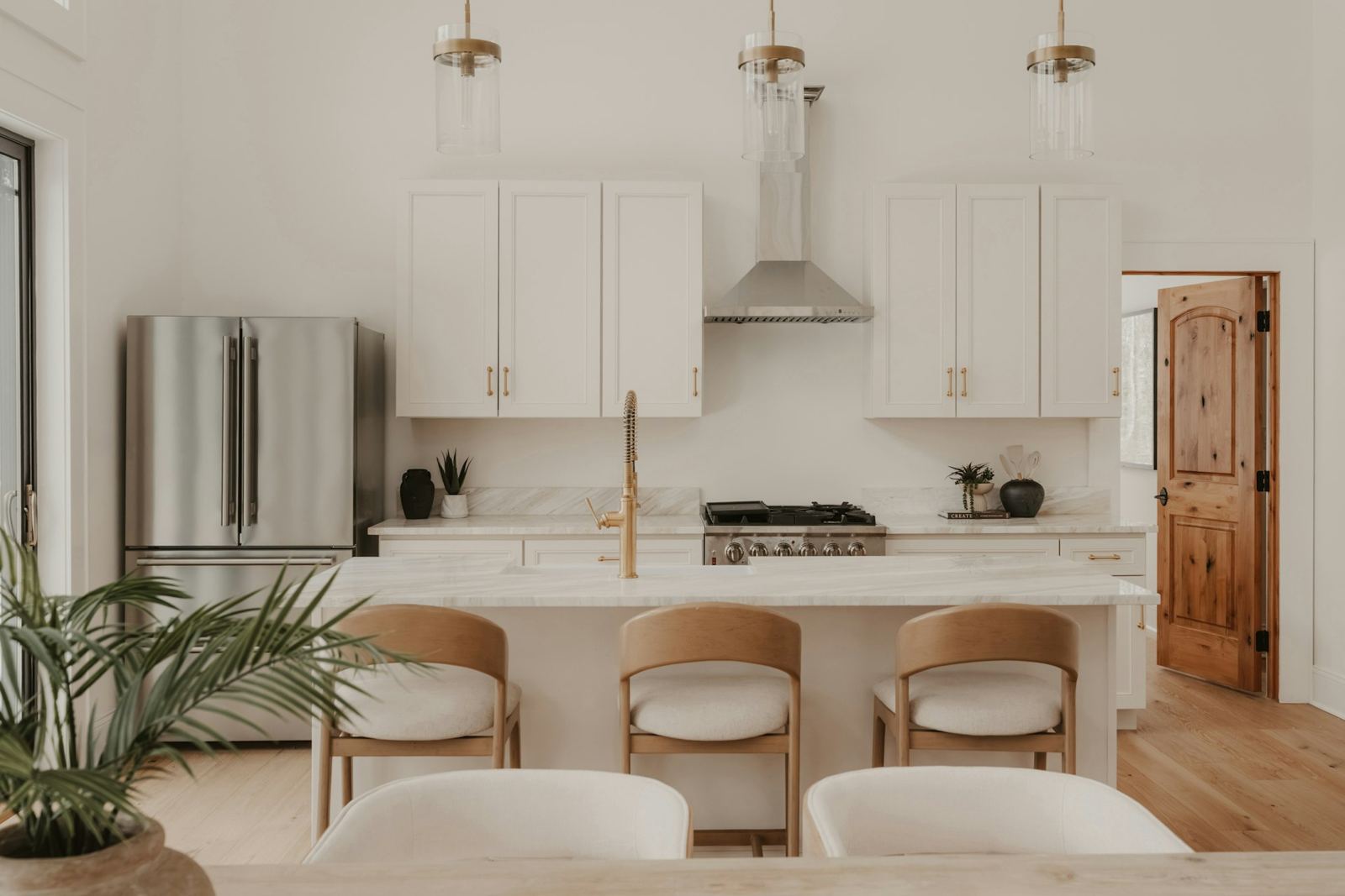 Modern white kitchen with a large island